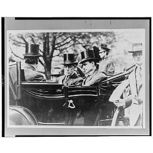  President Woodrow Wilson,wearing top hat,seated in open 
