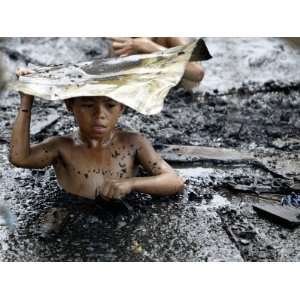  A Filipino Boy Wades Through Murky Waters Photographic 