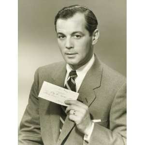  Businessman in Studio Showing Cheque, Portrait 