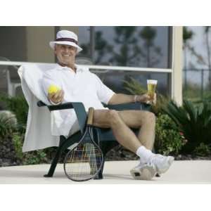  Man Relaxing with a Beer After His Tennis Match 