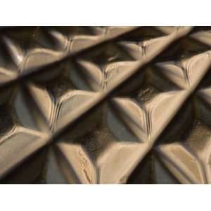  A Sheet of Metal with a Diamond Pattern Texture in Light 