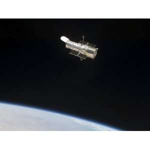  The Hubble Space Telescope in Orbit Above Earth Stretched 