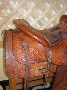   leather, well built, fully tooled leather. Suede padded seat, leather