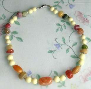 this is a pretty multi colored faux stones lucite necklace it is in 