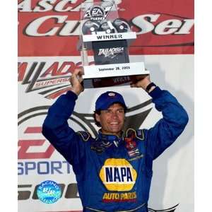  Michael Waltrip holding the Talladega trophy over his head 