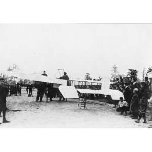  1909 photo Louis Blriot on his airplane, surrounded by 