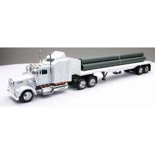 Kenworth W900 Flatbed Truck With Long Pipe