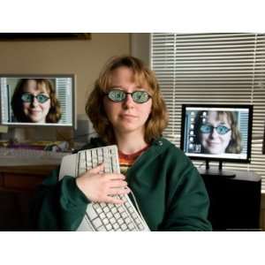  A Female Wears Circuit Glasses in Front of Two Computer 