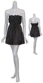 Chic little black dress has woven ribbon detail covering the fitted 