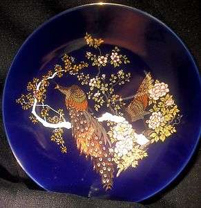 Dark blue porcelain decorative plate with gold peacock  