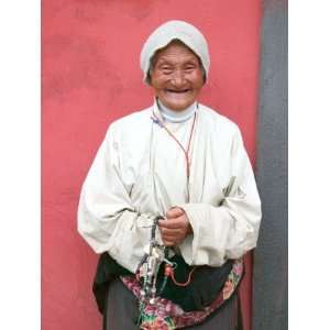  Elderly Tibetan Woman with Red Wall, Tagong, Sichuan 