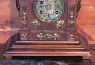 An 8 Day German Clock in a Solid Walnut Case With Brass  